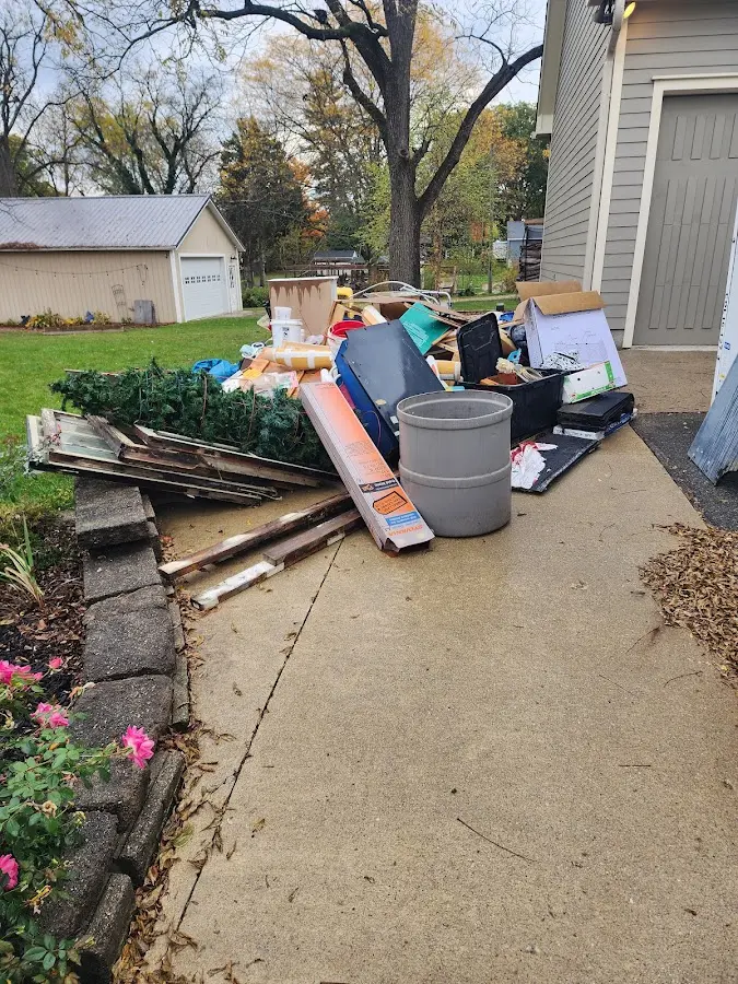 Dumpster being loaded with debris for Commercial Dumpster Rental in Maryland City